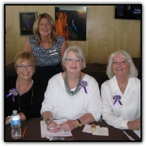 Service with a smile: volunteers welcome guests at registration